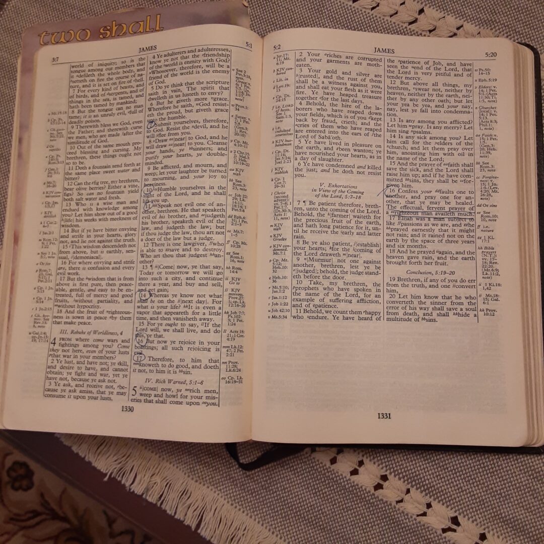 Bible open on table ready for prayer for small groups.