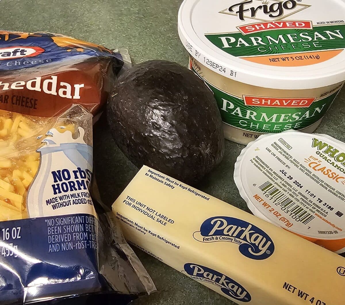 Toppings for baked potatoes: cheese, butter, sour cream, avocado.