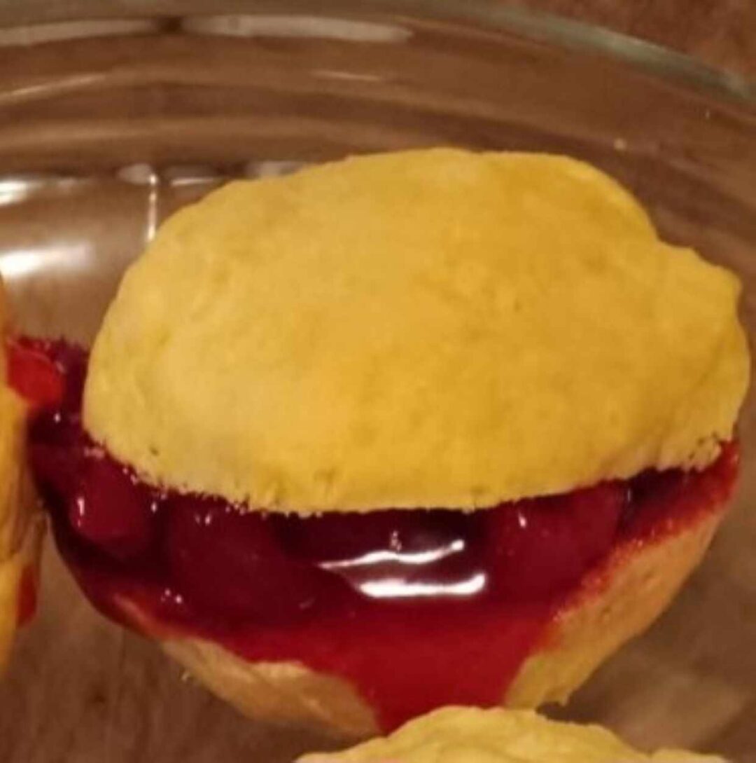 Biscuit with cherry pie filling.