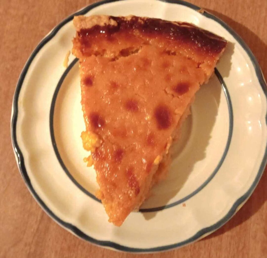 Sweet potato pie slice on a plate.